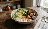 Beef Rice Bowl with Lettuce, Red Onion, and Creamy Chili Orange Sauce